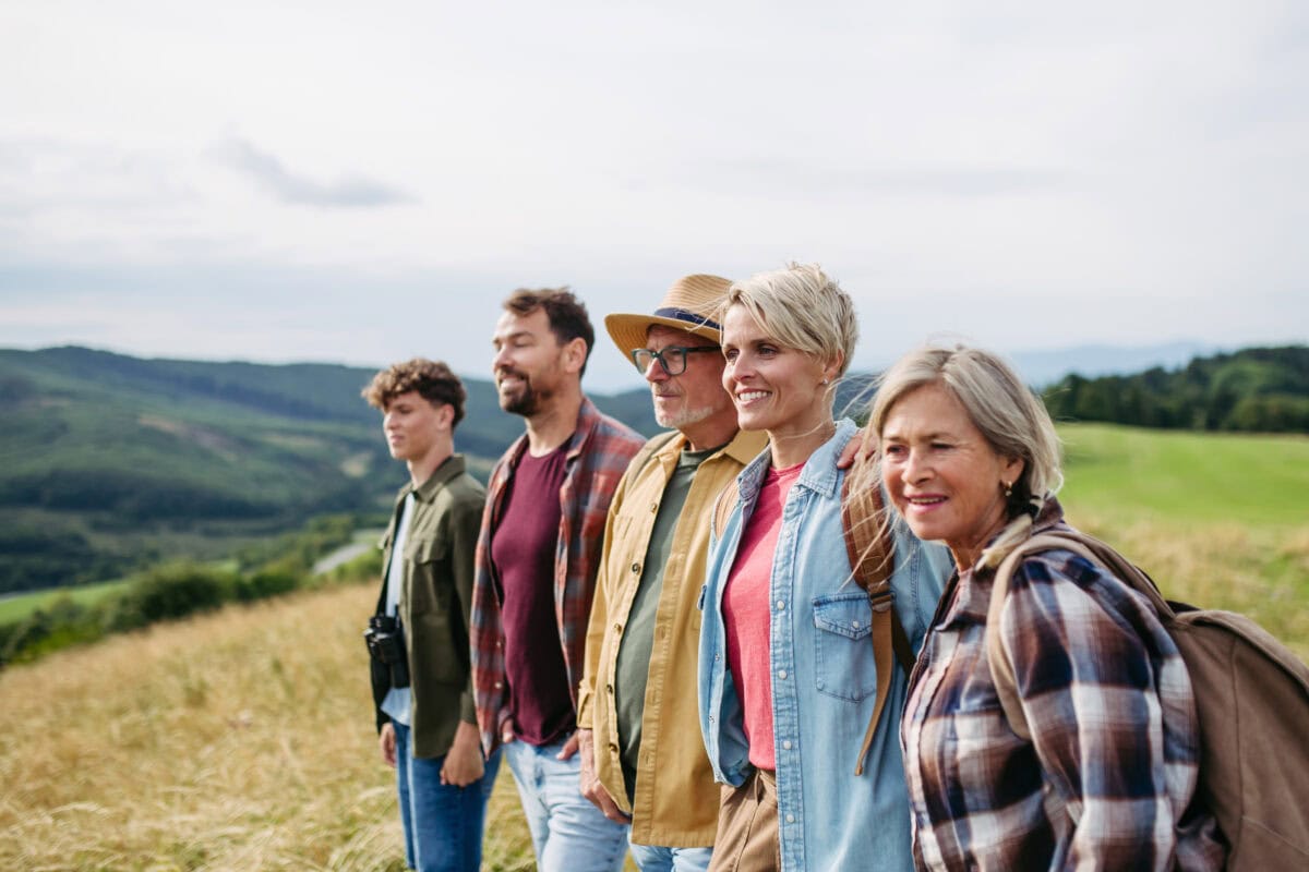 Multigenerational family on hiking trip in nature.